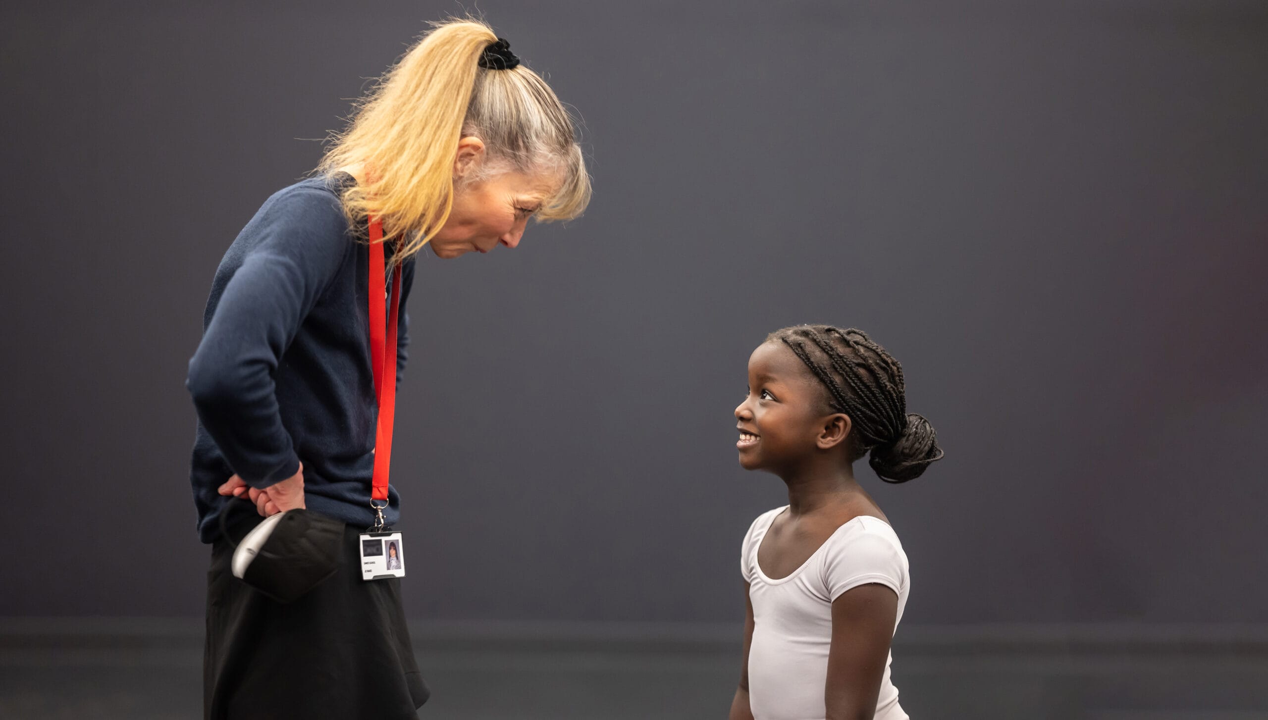 find an RAD teacher | Royal Academy of Dance RAD registered teacher and young student outside classroom