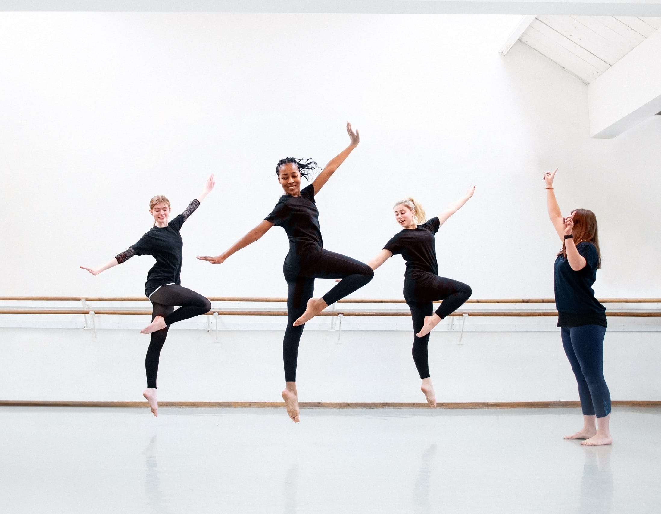 RAD-RTS-card-TCross | Royal Academy of Dance three students dancing in RAD headquarters studio