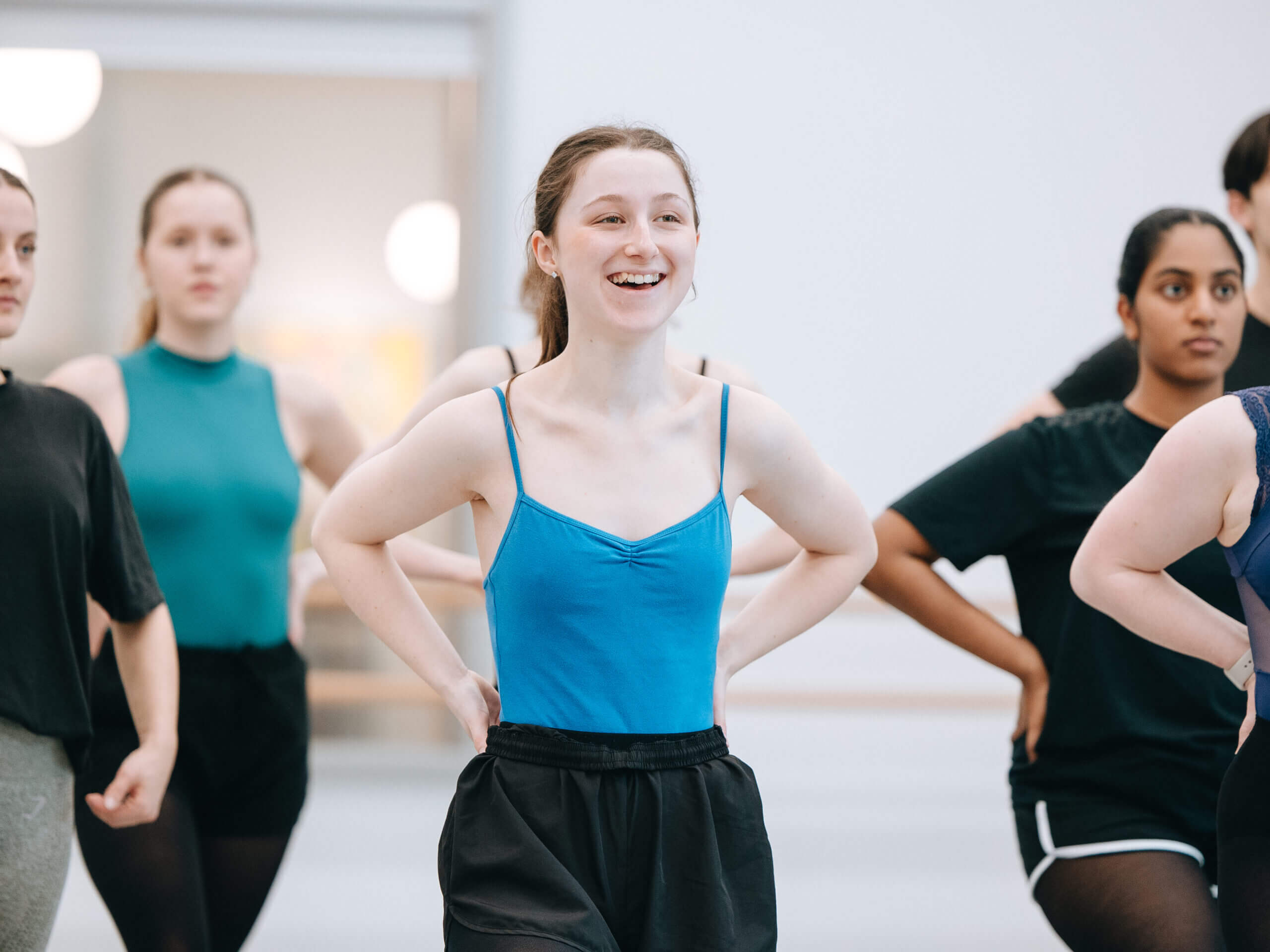 teacher testimonial | Royal Academy of Dance a student smiling in a dance at the RAD