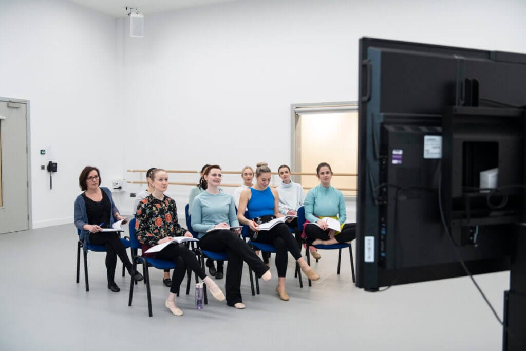 Image of attendees watching an online event
